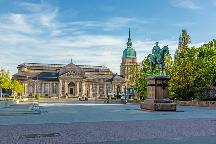 Photo of Panoramic view over Friedensplatz square to Hessian State Museum in German university city Darmstadt during daytime .