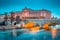 photo of beautiful view of famous Museum of Medieval Stockholm with Norrbro bridge at twilight in winter, central Stockholm, Sweden.