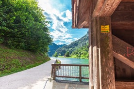 photo of historic town of Berchtesgaden with famous Watzmann mountain in the background on a sunny day with blue sky and clouds in springtime, National Park Berchtesgaden Land, Upper Bavaria, Germany.