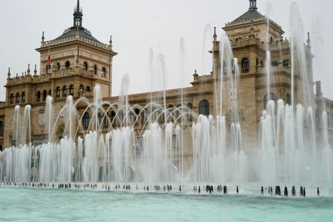 Photo of Zorrilla square fountain in Valladolid Spain with the Town Hall in the background historic buildings of Valladolid tourism of Valladolid Spain .