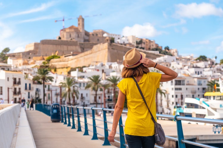 A young woman on spring vacation in Ibiza town next to the lighthouse, Balearic Islands.jpg