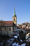 Bern, Switzerland. View of the old city center and Nydeggbrucke bridge over river Aare.