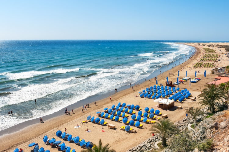 Photo of aerial view of sandy beach Playa del Ingles, Maspalomas, Gran Canaria, Spain.