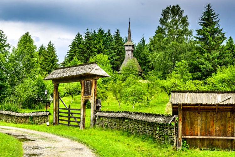 photo of view of Sighetu Marmatiei, Romania. Old vilage in Maramures, Romanian traditional architectural style, life in the countryside.