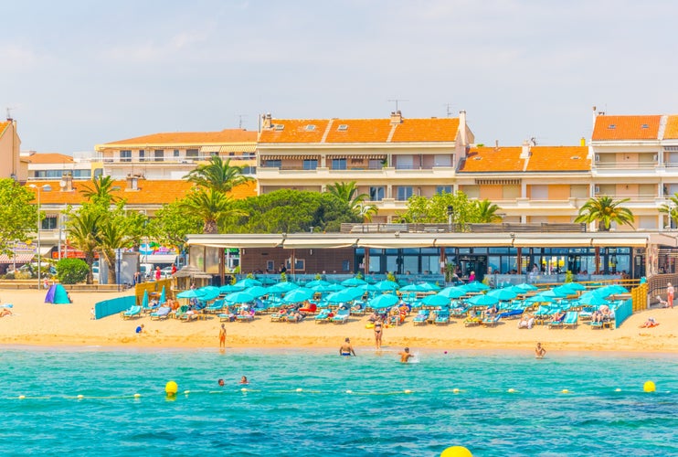 People are enjoying summer on a beach in Saint Raphael, France