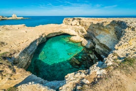 Photo of aerial view of Otranto town in Puglia with crystal turquoise waters, Italy.