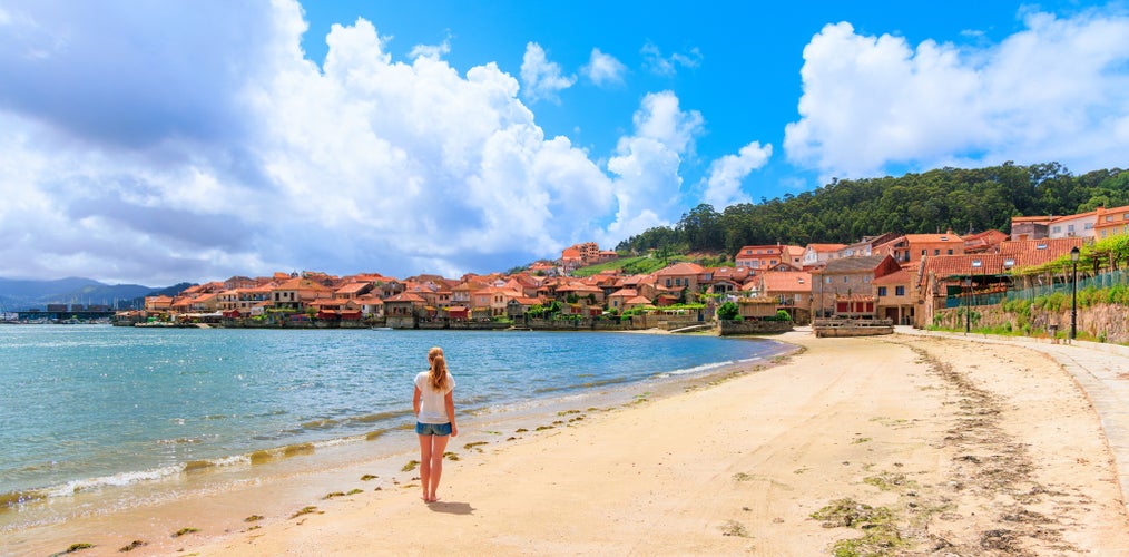 photo of Woman tourist in Combarro, Galicia, Spain.