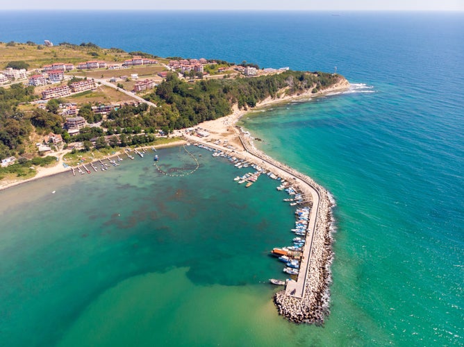 Aerial photo of the beautiful small town and seaside resort of Obzor in Bulgaria showing the fishing and marina side of the town showing fishing boats and the small sunny beach