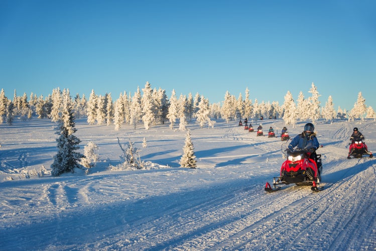 photo of group of snowmobiles in Lapland, near Saariselka, Finland.