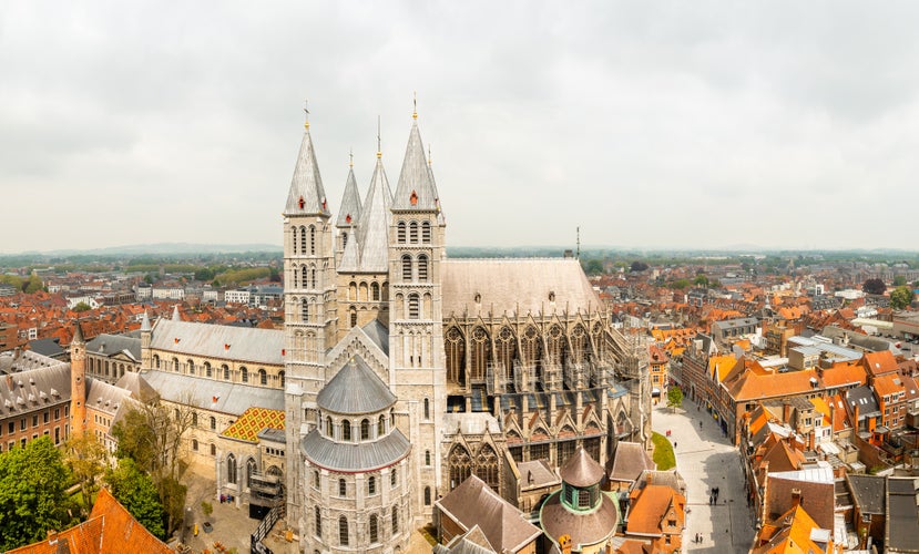 Photo of Notre-Dame de Tournai towers and surrounfing streets with old buildings panorama, Cathedral of Our Lady, Tournai, Walloon municipality, Belgium.