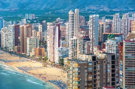 Photo of aerial panoramic view coastline and La Vila Joiosa Villajoyosa touristic resort townscape, sandy beach and Mediterranean seascape, Costa Blanca, Spain.