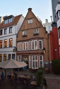 Photo of beautiful panoramic view of historic Bremen Market Square in the center of the Hanseatic City of Bremen with The Schuetting and famous Raths buildings on a sunny day with blue sky in summer, Germany.