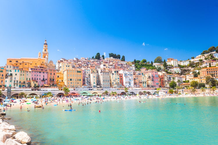 Menton, mediterranean sea on côte d'azur in France, historic architecture near turistic beach