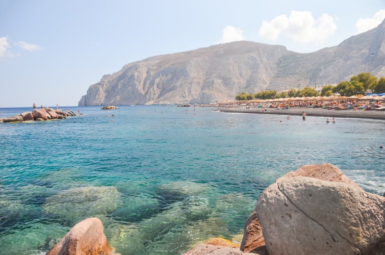 Photo of gorgeous black beach on the island of Santorini.