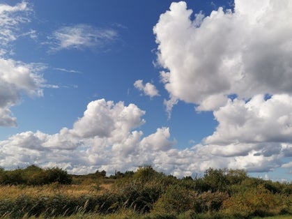 Photo of majestic clouds over Amager Fælled, Copenhagen, Denmark.
