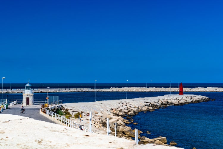 Photo of beautiful view of the sea and the port of Trani. Blue sky and sea. In Puglia, near Bari, Barletta, Andria.Italy.