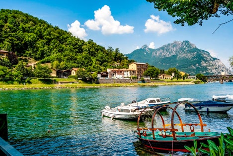 Pescarenico, a district of Lecco, once a fishing village, on the left side of the river Adda, quoted in Alessandro Manzoni's novel The Betrothed, with moored boats, Lecco, Lombardia, northern Italy