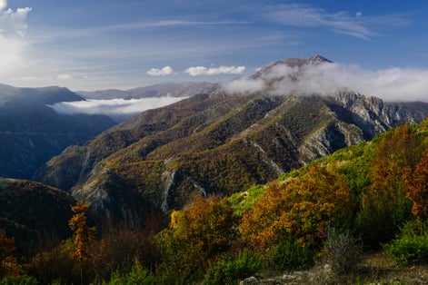 Photo of view from Vodno mountain towards Matka canyon and the Suva mountain peaks in North Macedonia.