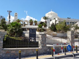 Photo of beautiful White architecture of Oia village on Santorini island, Greece.