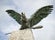 photo of view of Bronze turul Bird statue on top of column at Sandor Palace on Buda Hill in Budapest winter morning, Tatabánya, Hungary.