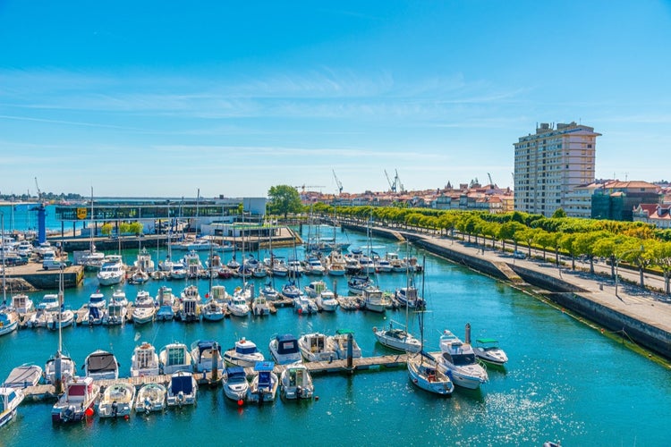 VIANA DO CASTELO, PORTUGAL -  several boats on the Lima River in Viana do Castelo harbor during a sunny day