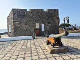 Photo of aerial view with Puerto de la Cruz, in background Teide volcano, Tenerife island, Spain.