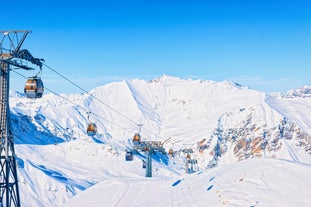 Photo of panorama of Hintertux ski resort in Zillertal Alps in Austria with the far view of ski lifts and pistes.