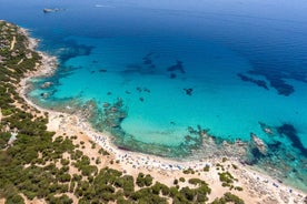 Photo of aerial view of a beautiful bay with azure sea from top of a hill, Villasimius, Sardinia island, Italy.