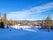 photo of skiers on a ski slope leading to the ski lift at Järvsöbacken ski resort in Järvso, Sweden.